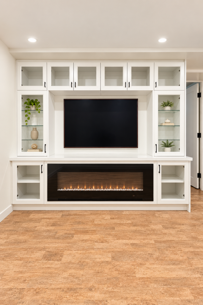 Custom basement entertainment unit and fireplace by Elegant Design Inc. in Thunder Bay